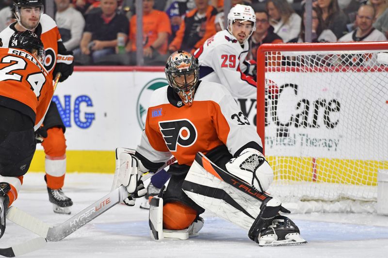 Apr 16, 2024; Philadelphia, Pennsylvania, USA; Philadelphia Flyers goaltender Samuel Ersson (33) makes a save against the Washington Capitals during the first period at Wells Fargo Center. Mandatory Credit: Eric Hartline-USA TODAY Sports