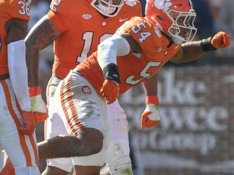 Nov 4, 2023; Clemson, South Carolina, USA;  Clemson Tigers linebacker Jeremiah Trotter Jr. (54) sacks Notre Dame Fighting Irish quarterback Sam Hartman (10) during the fourth quarter at Memorial Stadium. Mandatory Credit: Ken Ruinard-USA TODAY Sports