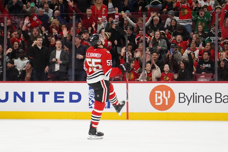 Jan 1, 2026; Chicago, Illinois, USA; Chicago Blackhawks defenseman Artyom Levshunov (55) celebrates his goal against the Dallas Stars during the first period at United Center. Mandatory Credit: David Banks-Imagn Images