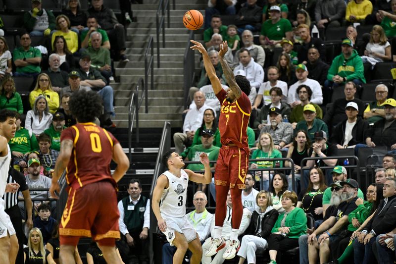Mar 1, 2025; Eugene, Oregon, USA; USC Trojans guard Chibuzo Agbo (7) shoots the ball during the first half against the Oregon Ducks at Matthew Knight Arena. Mandatory Credit: Craig Strobeck-Imagn Images
