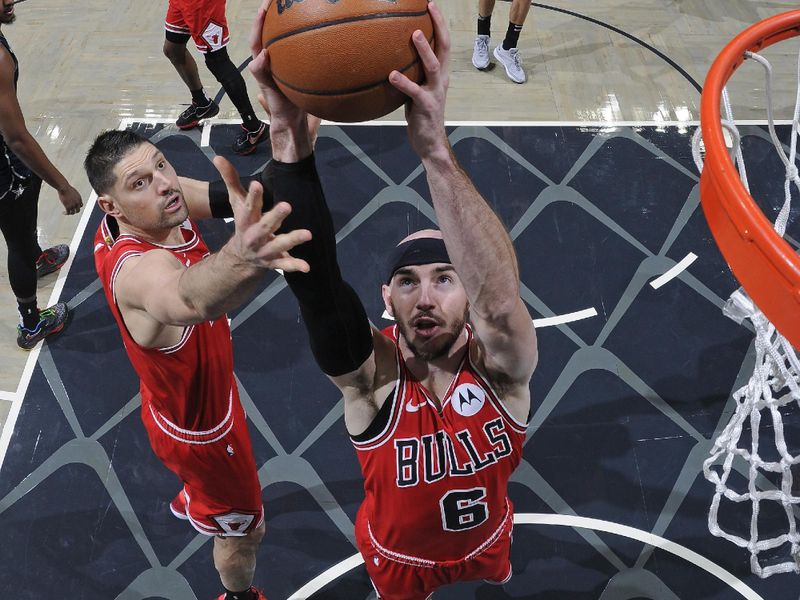 ORLANDO, FL - FEBRUARY 10: Alex Caruso #6 of the Chicago Bulls grabs a rebound during the game against the Orlando Magic on February 10, 2024 at the Kia Center in Orlando, Florida. NOTE TO USER: User expressly acknowledges and agrees that, by downloading and or using this photograph, User is consenting to the terms and conditions of the Getty Images License Agreement. Mandatory Copyright Notice: Copyright 2024 NBAE (Photo by Fernando Medina/NBAE via Getty Images)