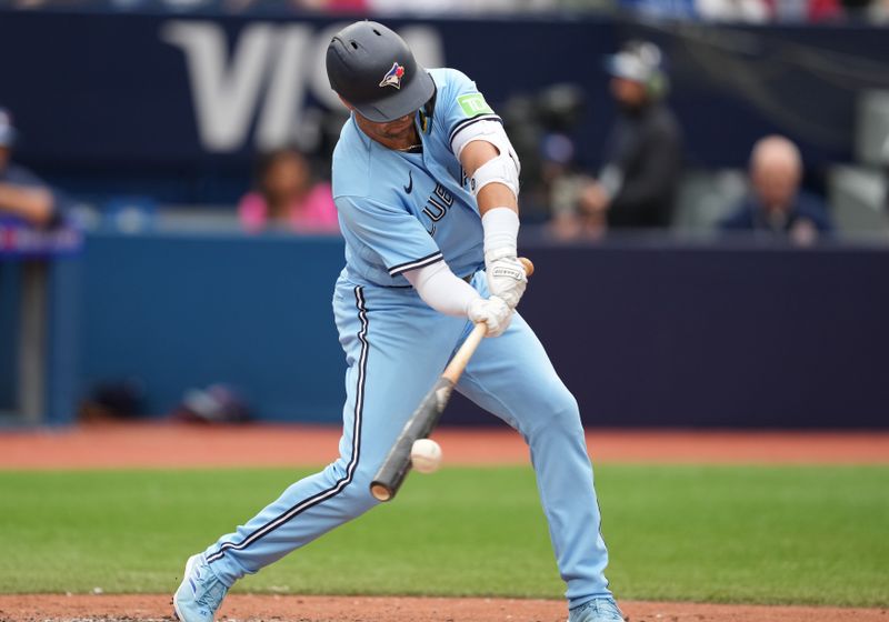 Aug 30, 2023; Toronto, Ontario, CAN; Toronto Blue Jays left fielder Whit Merrifield (15) hits a single against the Washington Nationals during the seventh inning at Rogers Centre. Mandatory Credit: Nick Turchiaro-USA TODAY Sports