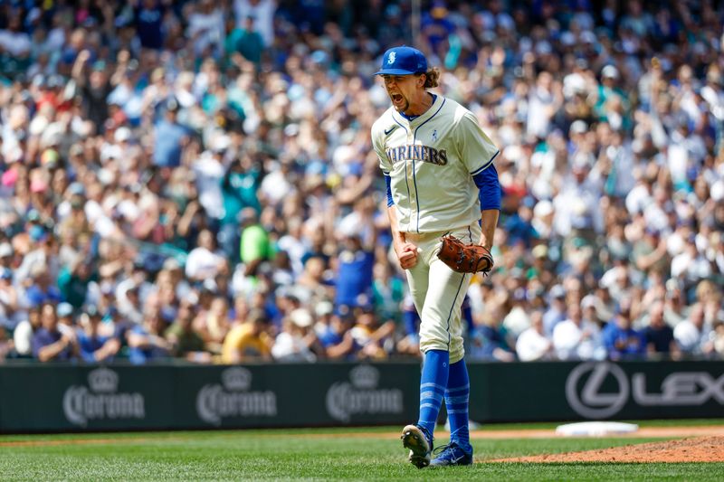 Jun 16, 2024; Seattle, Washington, USA; Seattle Mariners starting pitcher Logan Gilbert (36) reacts following the final out of the top of the eighth inning against the Texas Rangers at T-Mobile Park. Mandatory Credit: Joe Nicholson-USA TODAY Sports