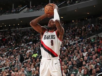 MILWAUKEE, WI - NOVEMBER 26: Jerami Grant #9 of the Portland Trail Blazers shoots a three point basket during the game against the Milwaukee Bucks on November 26, 2023 at the Fiserv Forum Center in Milwaukee, Wisconsin. NOTE TO USER: User expressly acknowledges and agrees that, by downloading and or using this Photograph, user is consenting to the terms and conditions of the Getty Images License Agreement. Mandatory Copyright Notice: Copyright 2023 NBAE (Photo by Gary Dineen/NBAE via Getty Images).