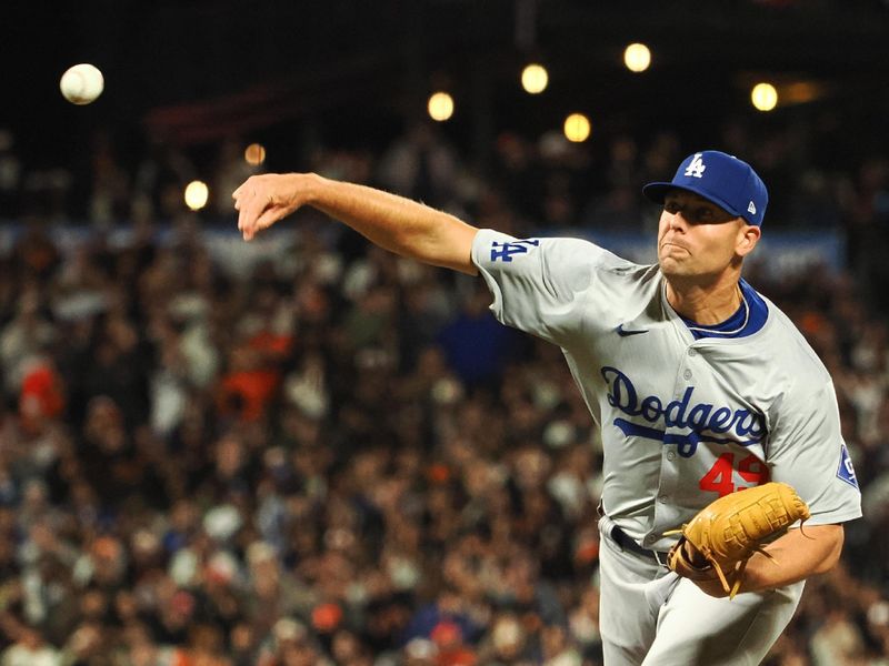 Jun 28, 2024; San Francisco, California, USA; Los Angeles Dodgers relief pitcher Blake Treinen (49) pitches against the San Francisco Giants during the ninth inning at Oracle Park. Mandatory Credit: Kelley L Cox-USA TODAY Sports