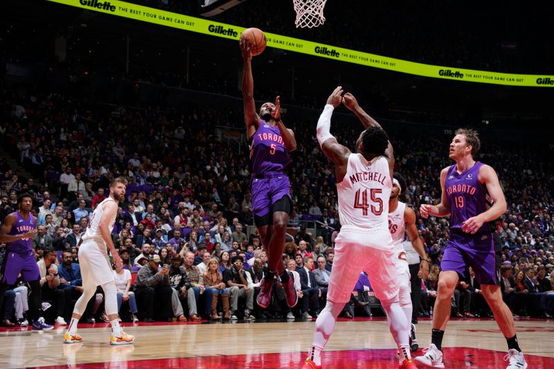 TORONTO, CANADA - OCTOBER 23: Immanuel Quickley #5 of the Toronto Raptors drives to the basket during the game against the Cleveland Cavaliers on October 23, 2024 at the Scotiabank Arena in Toronto, Ontario, Canada.  NOTE TO USER: User expressly acknowledges and agrees that, by downloading and or using this Photograph, user is consenting to the terms and conditions of the Getty Images License Agreement.  Mandatory Copyright Notice: Copyright 2024 NBAE (Photo by Mark Blinch/NBAE via Getty Images)