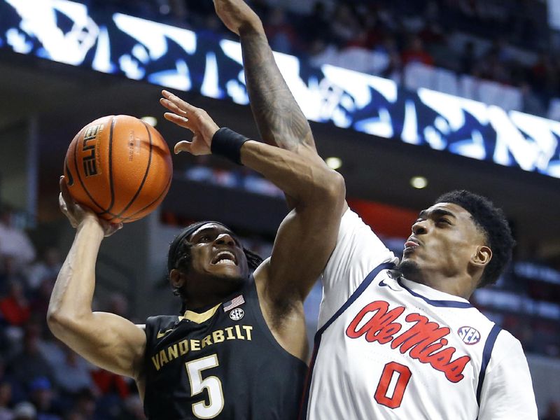 Jan 13, 2024; Oxford, Mississippi, USA; Vanderbilt Commodores guard Ezra Manjon (5) shoots the ball against Mississippi Rebels guard Brandon Murray (0) during the first half at The Sandy and John Black Pavilion at Ole Miss. Mandatory Credit: Petre Thomas-USA TODAY Sports