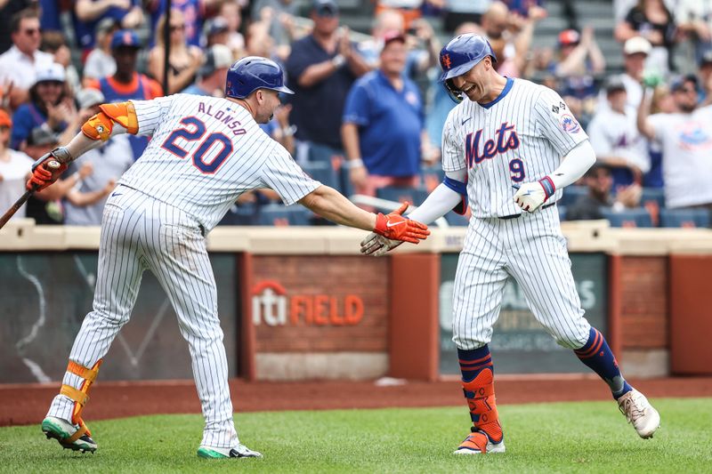 Jun 30, 2024; New York City, New York, USA;  New York Mets center fielder Brandon Nimmo (9) celebrates with first baseman Pete Alonso (20) after hitting a two run home run to tie the game in the seventh inning against the Houston Astros at Citi Field. Mandatory Credit: Wendell Cruz-USA TODAY Sports