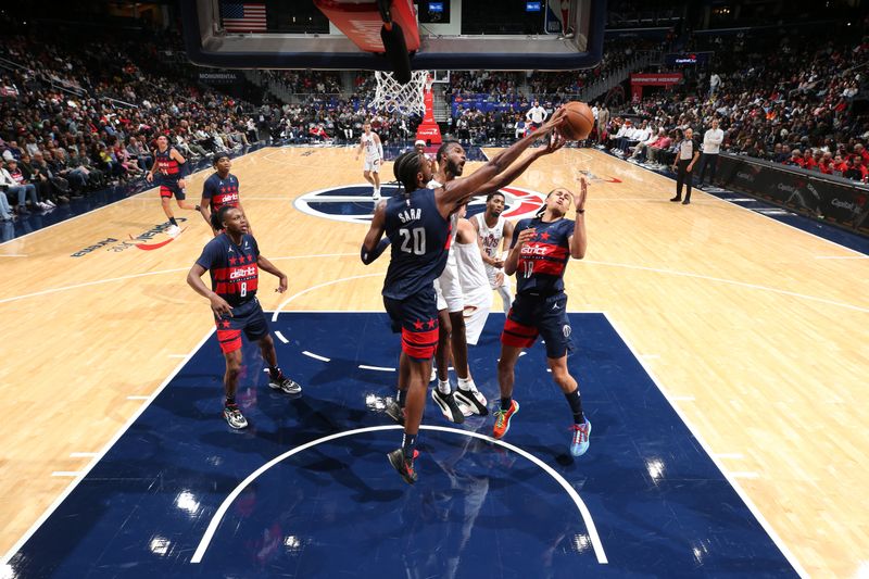 WASHINGTON, DC -? OCTOBER 26: Alexandre Sarr #20 of the Washington Wizards blocks a shot during the game against the Cleveland Cavaliers on October 26, 2024 at Capital One Arena in Washington, DC. NOTE TO USER: User expressly acknowledges and agrees that, by downloading and or using this Photograph, user is consenting to the terms and conditions of the Getty Images License Agreement. Mandatory Copyright Notice: Copyright 2024 NBAE (Photo by Stephen Gosling/NBAE via Getty Images)