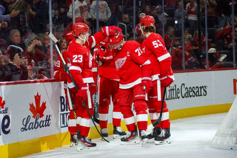 Nov 2, 2024; Detroit, Michigan, USA; The Detroit Red Wings celebrate a goal by center Dylan Larkin (71) during the second period of the game against the Buffalo Sabres at Little Caesars Arena. Mandatory Credit: Brian Bradshaw Sevald-Imagn Images