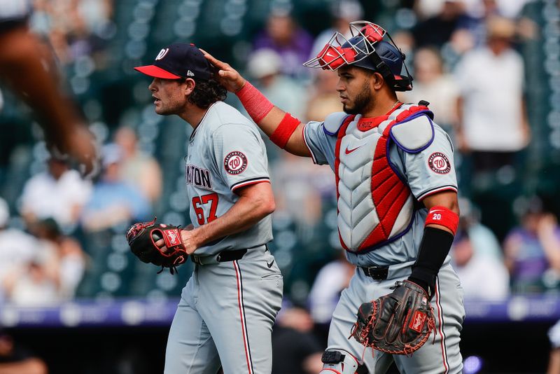 Jun 23, 2024; Denver, Colorado, USA; Washington Nationals relief pitcher Kyle Finnegan (67) reacts with catcher Keibert Ruiz (20) after the game against the Colorado Rockies at Coors Field. Mandatory Credit: Isaiah J. Downing-USA TODAY Sports