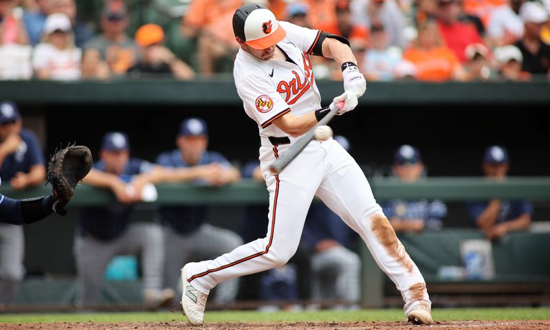 Jun 2, 2024; Baltimore, Maryland, USA; Baltimore Orioles outfielder Austin Hays (21) swings during the seventh inning against the Tampa Bay Rays at Oriole Park at Camden Yards. Mandatory Credit: Daniel Kucin Jr.-USA TODAY Sports