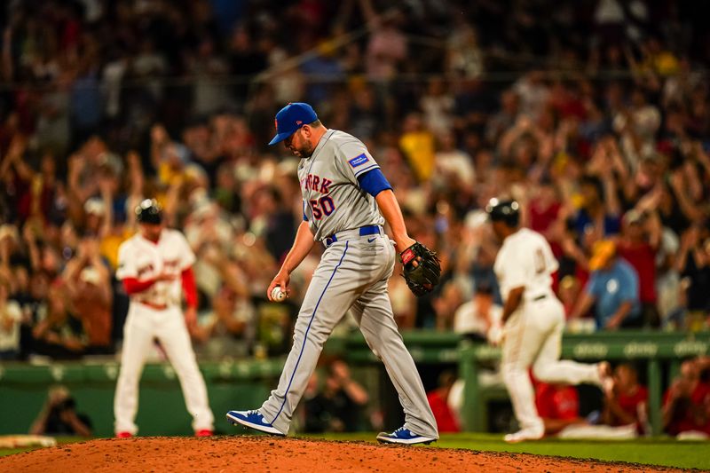 Jul 23, 2023; Boston, Massachusetts, USA; Boston Red Sox third baseman Rafael Devers (11) hits a home run against New York Mets relief pitcher Dominic Leone (50) in the seventh inning at Fenway Park. Mandatory Credit: David Butler II-USA TODAY Sports