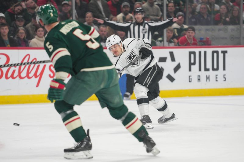 Feb 21, 2023; Saint Paul, Minnesota, USA; Los Angeles Kings right wing Viktor Arvidsson (33) shoots Minnesota Wild defenseman Jake Middleton (5) on defense in the first period at Xcel Energy Center. Mandatory Credit: Matt Blewett-USA TODAY Sports