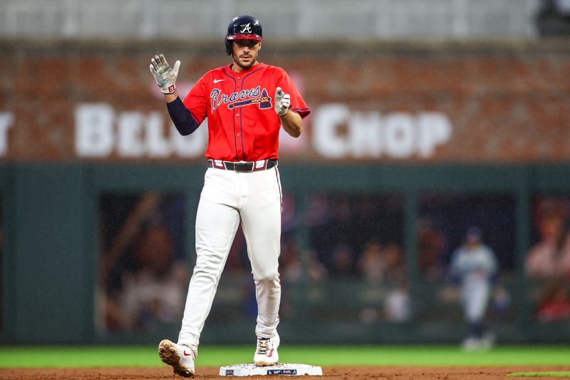 Sep 13, 2024; Atlanta, Georgia, USA; Atlanta Braves first baseman Matt Olson (28) reacts after an RBI double against the Los Angeles Dodgers in the first inning at Truist Park. Mandatory Credit: Brett Davis-Imagn Images
