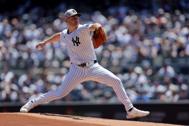 May 17, 2025; Bronx, New York, USA; New York Yankees starting pitcher Clarke Schmidt (36) pitches against the New York Mets during the first inning at Yankee Stadium. Mandatory Credit: Brad Penner-Imagn Images