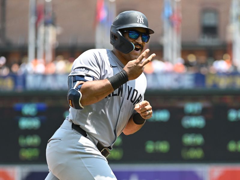 Jul 14, 2024; Baltimore, Maryland, USA;  New York Yankees outfielder Trent Grisham (12) gestures towards the dugout after hitting a home run during the fifth inning against the Baltimore Orioles at Oriole Park at Camden Yards. Mandatory Credit: James A. Pittman-USA TODAY Sports