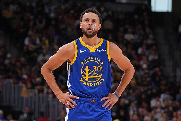 DENVER, CO - DECEMBER 25: Stephen Curry #30 of the Golden State Warriors looks on during the game against the Denver Nuggets on December 25, 2023 at the Ball Arena in Denver, Colorado. NOTE TO USER: User expressly acknowledges and agrees that, by downloading and/or using this Photograph, user is consenting to the terms and conditions of the Getty Images License Agreement. Mandatory Copyright Notice: Copyright 2023 NBAE (Photo by Bart Young/NBAE via Getty Images)