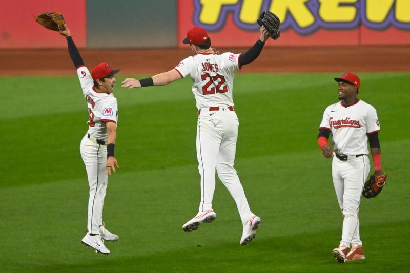 Sep 9, 2025; Cleveland, Ohio, USA; The Cleveland Guardians outfielders celebrate a win over the Kansas City Royals at Progressive Field. Mandatory Credit: David Richard-Imagn Images