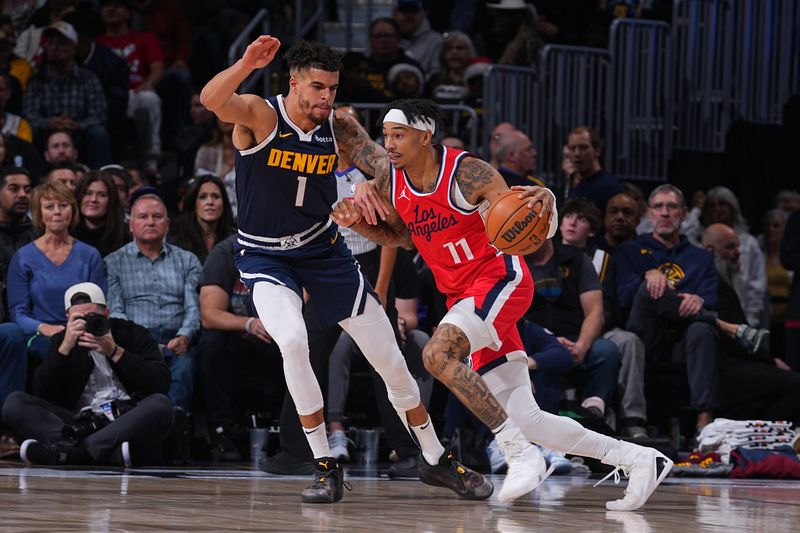 DENVER, CO - DECEMBER 13: Jordan Miller #11 of the LA Clippers handles the ball during the game against the Denver Nuggets on December 13, 2024 at Ball Arena in Denver, Colorado. NOTE TO USER: User expressly acknowledges and agrees that, by downloading and/or using this Photograph, user is consenting to the terms and conditions of the Getty Images License Agreement. Mandatory Copyright Notice: Copyright 2024 NBAE (Photo by Bart Young/NBAE via Getty Images)