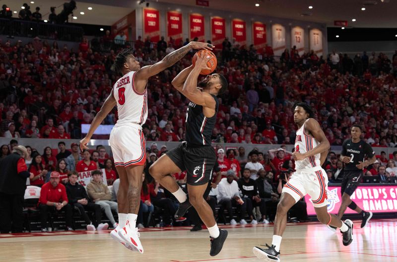 Jan 28, 2023; Houston, Texas, USA; Cincinnati Bearcats guard David DeJulius (5) has his shot blocked by Houston Cougars forward Ja'Vier Francis (5) in the second half at Fertitta Center. Houston Cougars won 75 to 69 .Mandatory Credit: Thomas Shea-USA TODAY Sports