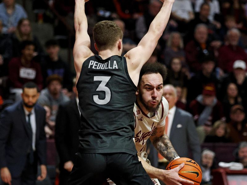 Jan 23, 2024; Blacksburg, Virginia, USA; Boston College Eagles guard Jaeden Zackery (3) drives to the basket against Virginia Tech Hokies guard Sean Pedulla (3) during the first half at Cassell Coliseum. Mandatory Credit: Peter Casey-USA TODAY Sports