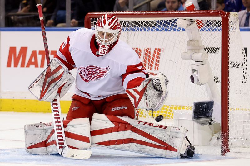 Nov 29, 2023; New York, New York, USA; Detroit Red Wings goaltender Ville Husso (35) plays the puck against the New York Rangers during the third period at Madison Square Garden. Mandatory Credit: Brad Penner-USA TODAY Sports