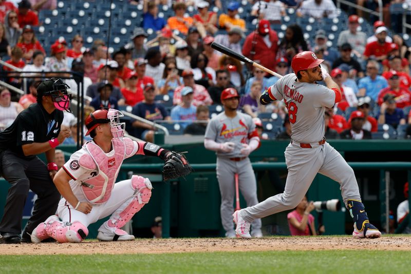 May 11, 2025; Washington, District of Columbia, USA; St. Louis Cardinals third base Nolan Arenado (28) hits a two run home run against the Washington Nationals during the eighth inning at Nationals Park. Mandatory Credit: Geoff Burke-Imagn Images