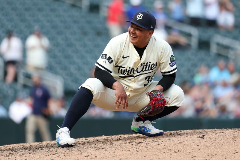 Aug 17, 2025; Minneapolis, Minnesota, USA; Minnesota Twins pitcher Erasmo Ramirez (30) reacts to his teams win against the Detroit Tigers after the game at Target Field. Mandatory Credit: Matt Krohn-Imagn Images