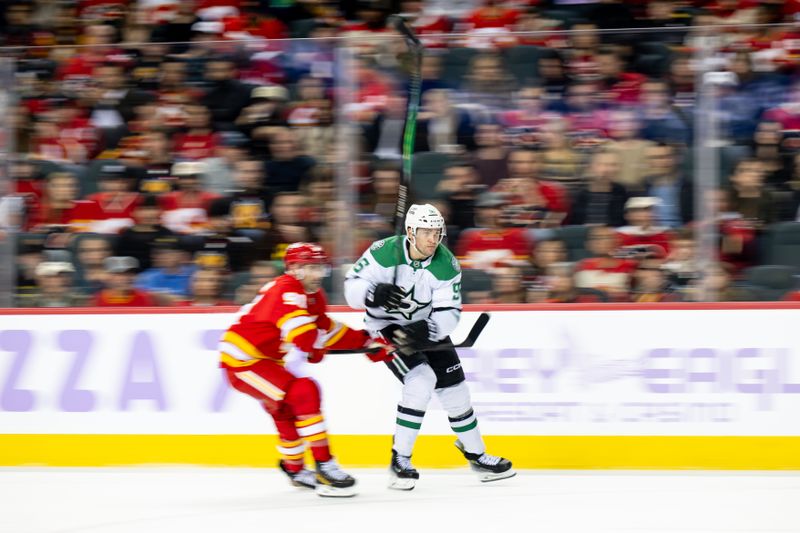 Nov 22, 2025; Calgary, Alberta, CAN; Dallas Stars right wing Mikko Rantanen (96) skates past Calgary Flames center Nazem Kadri (91) during the second period at Scotiabank Saddledome. Mandatory Credit: Brett Holmes-Imagn Images