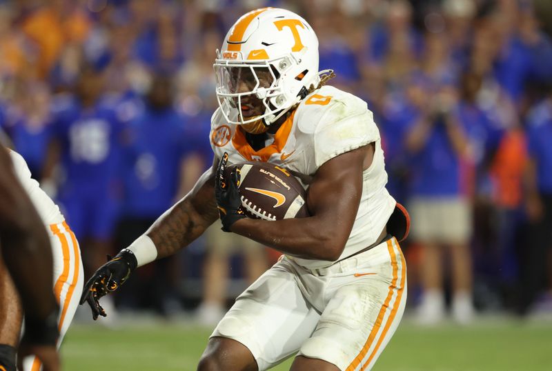 Sep 16, 2023; Gainesville, Florida, USA; Tennessee Volunteers running back Jaylen Wright (0) runs with the ball against the Florida Gators during the second half at Ben Hill Griffin Stadium. Mandatory Credit: Kim Klement Neitzel-USA TODAY Sports