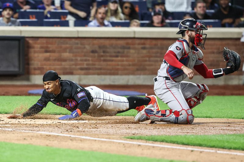 Sep 2, 2024; New York City, New York, USA;  New York Mets shortstop Francisco Lindor (12) slides safely past Boston Red Sox catcher Connor Wong (12) in the third inning at Citi Field. Mandatory Credit: Wendell Cruz-USA TODAY Sports