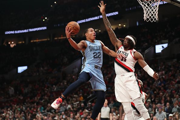 PORTLAND, OREGON - NOVEMBER 05: Desmond Bane #22 of the Memphis Grizzlies drives to the basket against Robert Williams III #35 of the Portland Trail Blazers during the first quarter at Moda Center on November 05, 2023 in Portland, Oregon. NOTE TO USER: User expressly acknowledges and agrees that, by downloading and or using this photograph, User is consenting to the terms and conditions of the Getty Images License Agreement.? (Photo by Amanda Loman/Getty Images)