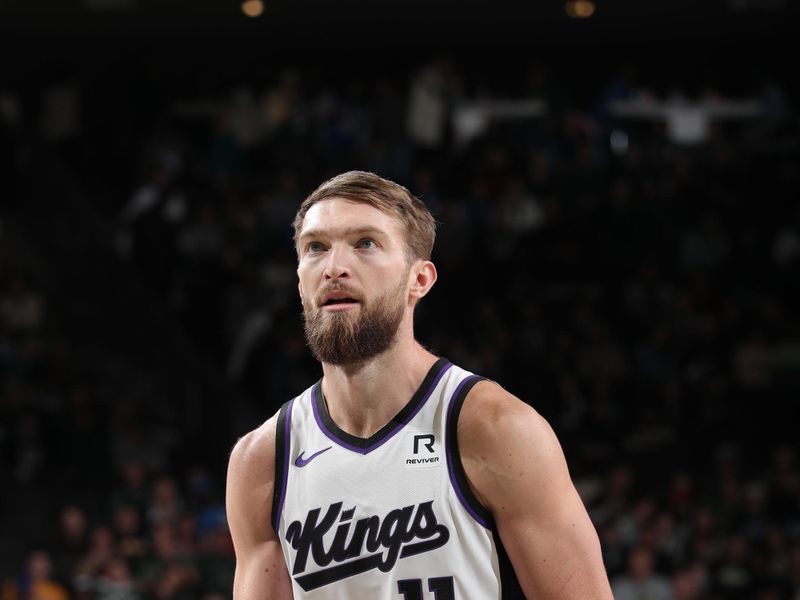 MILWAUKEE, WI - JANUARY 14: Domantas Sabonis #11 of the Sacramento Kings shoots a free throw during the game against the Milwaukee Bucks on January 14, 2025 at Fiserv Forum Center in Milwaukee, Wisconsin. NOTE TO USER: User expressly acknowledges and agrees that, by downloading and or using this Photograph, user is consenting to the terms and conditions of the Getty Images License Agreement. Mandatory Copyright Notice: Copyright 2025 NBAE (Photo by Gary Dineen/NBAE via Getty Images).