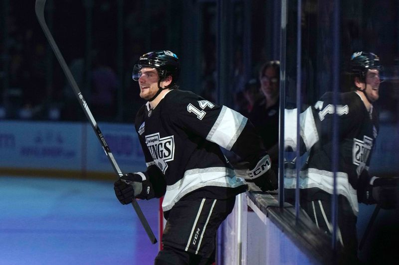 Nov 27, 2024; Los Angeles, California, USA; LA Kings right wing Alex Laferriere (14) is recognized as the first star of the night after the game against the Winnipeg Jets at Crypto.com Arena. Mandatory Credit: Kirby Lee-Imagn Images