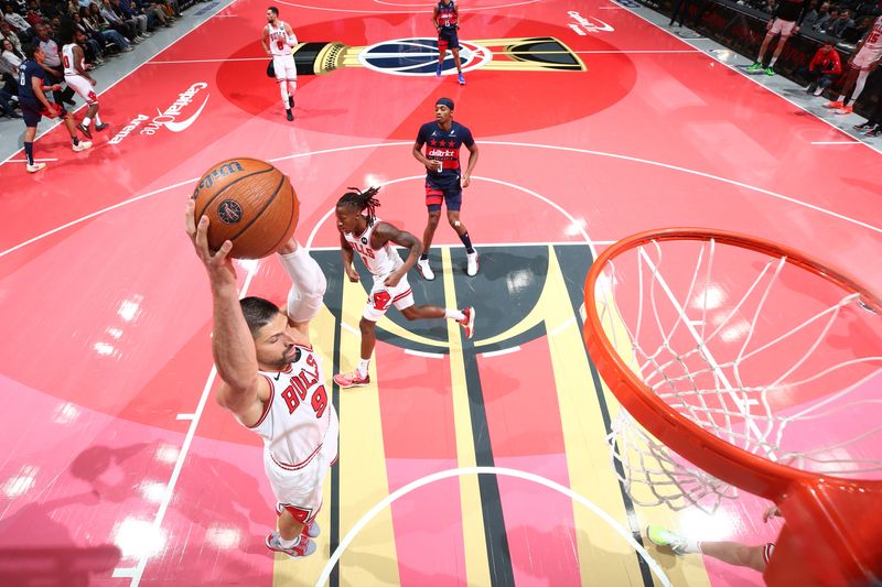 WASHINGTON, DC -? NOVEMBER 26: Nikola Vucevic #9 of the Chicago Bulls rebounds the ball during the game against the Washington Wizards during the Emirates NBA Cup game on November 26, 2024 at Capital One Arena in Washington, DC. NOTE TO USER: User expressly acknowledges and agrees that, by downloading and or using this Photograph, user is consenting to the terms and conditions of the Getty Images License Agreement. Mandatory Copyright Notice: Copyright 2024 NBAE (Photo by Stephen Gosling/NBAE via Getty Images)