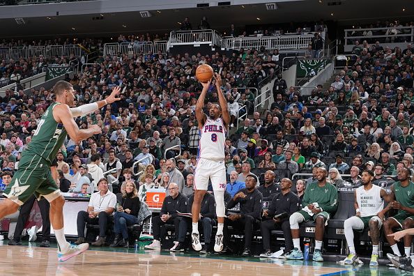 MILWAUKEE, WI - OCTOBER 26: De'Anthony Melton #8 of the Philadelphia 76ers shoots a three point basket against the Milwaukee Bucks on October 26, 2023 at the Fiserv Forum Center in Milwaukee, Wisconsin. NOTE TO USER: User expressly acknowledges and agrees that, by downloading and or using this Photograph, user is consenting to the terms and conditions of the Getty Images License Agreement. Mandatory Copyright Notice: Copyright 2023 NBAE (Photo by Jesse D. Garrabrant/NBAE via Getty Images).