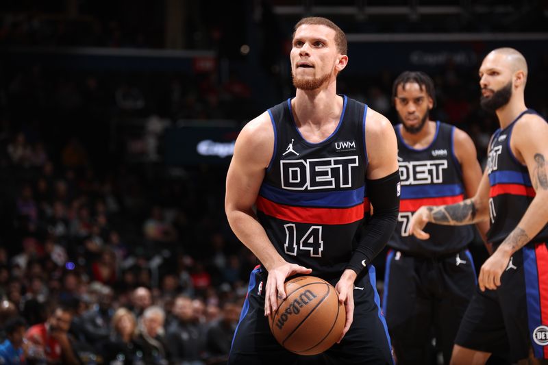 WASHINGTON, DC -? MARCH 29:  Malachi Flynn #14 of the Detroit Pistons shoots a free throw during the game on March 29, 2024 at Capital One Arena in Washington, DC. NOTE TO USER: User expressly acknowledges and agrees that, by downloading and or using this Photograph, user is consenting to the terms and conditions of the Getty Images License Agreement. Mandatory Copyright Notice: Copyright 2024 NBAE (Photo by Stephen Gosling/NBAE via Getty Images)