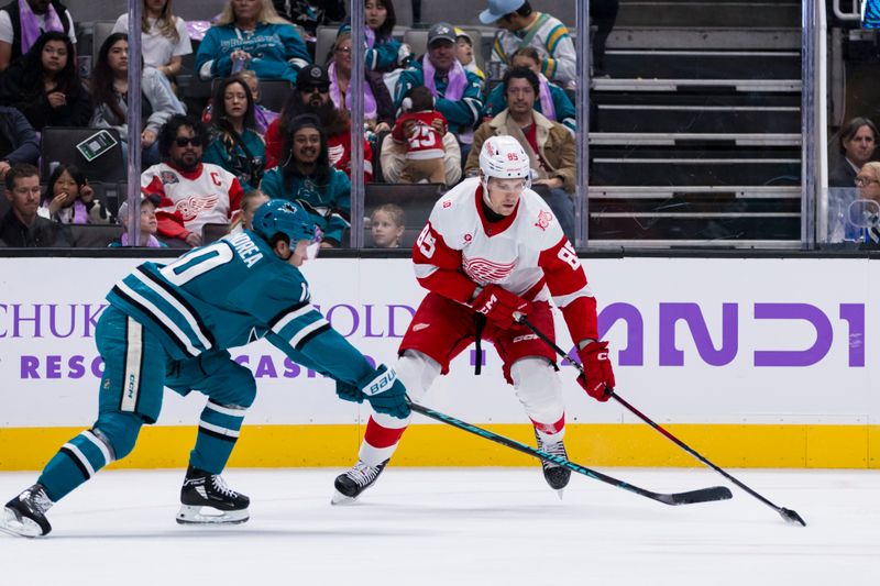 Nov 2, 2025; San Jose, California, USA;  San Jose Sharks center Ty Dellandrea (10) defends Detroit Red Wings left wing Elmer Soderblom (85) during the first period at SAP Center at San Jose. Mandatory Credit: John Hefti-Imagn Images