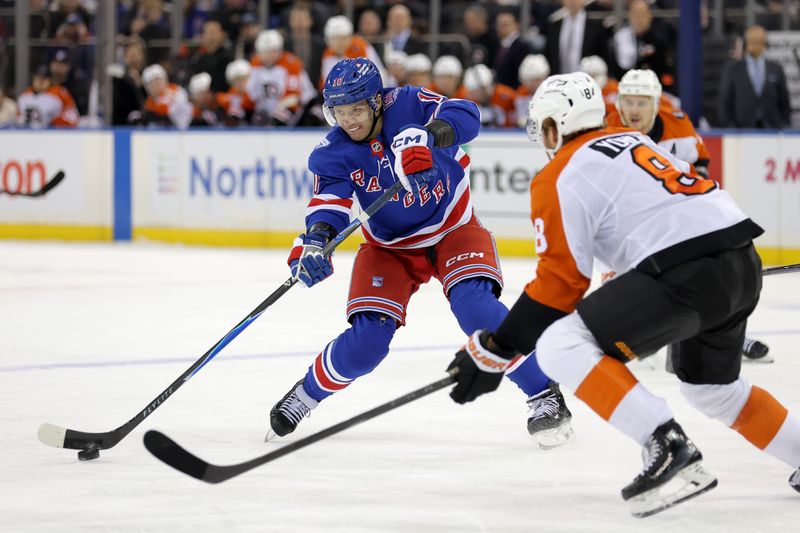 Dec 20, 2025; New York, New York, USA; New York Rangers left wing Artemi Panarin (10) looks to pass the puck against Philadelphia Flyers defenseman Cam York (8) during the second period at Madison Square Garden. Mandatory Credit: Brad Penner-Imagn Images