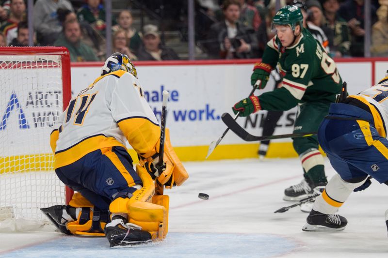 Dec 23, 2025; Saint Paul, Minnesota, USA; Nashville Predators goaltender Juuse Saros (74) makes a save on Minnesota Wild left wing Kirill Kaprizov (97) in the second period at Grand Casino Arena. Mandatory Credit: Matt Blewett-Imagn Images