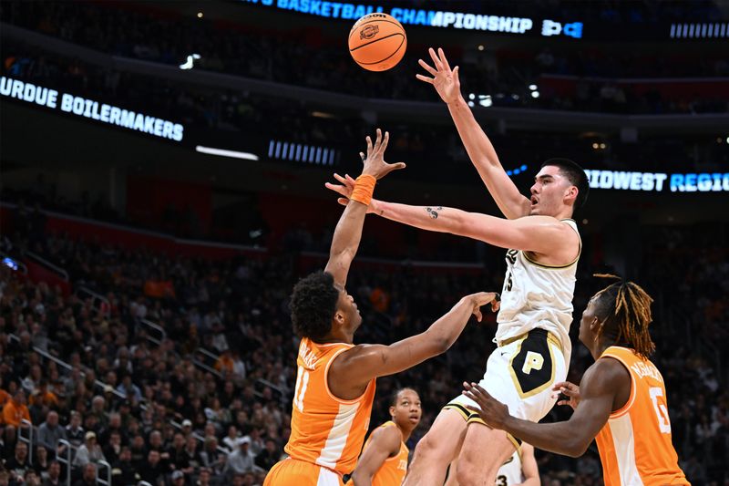 Mar 31, 2024; Detroit, MI, USA; Purdue Boilermakers center Zach Edey (15) shoots the ball over Tennessee Volunteers forward Tobe Awaka (11) in the first half  during the NCAA Tournament Midwest Regional Championship at Little Caesars Arena. Mandatory Credit: Lon Horwedel-USA TODAY Sports