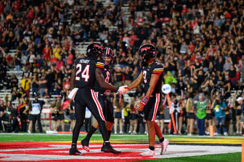 Sep 15, 2023; College Park, Maryland, USA; Maryland Terrapins running back Roman Hemby (24) scores a touchdown and celebrates with quarterback Taulia Tagovailoa (3) during the second quarter against the Virginia Cavaliers at SECU Stadium. Mandatory Credit: Reggie Hildred-USA TODAY Sports