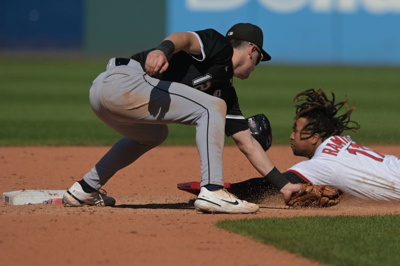 Sep 14, 2025; Cleveland, Ohio, USA; Cleveland Guardians designated hitter Jose Ramirez (11) steals second under the tag of Chicago White Sox shortstop Colson Montgomery (12) during the eighth inning at Progressive Field. Mandatory Credit: Ken Blaze-Imagn Images