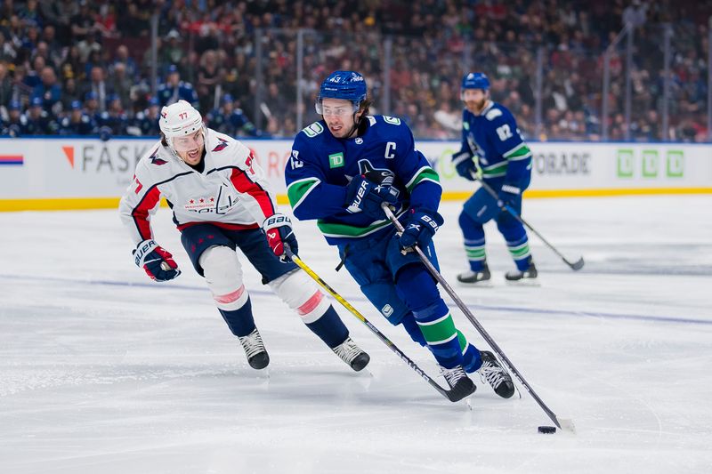 Mar 16, 2024; Vancouver, British Columbia, CAN; Vancouver Canucks defenseman Quinn Hughes (43) drives past Washington Capitals forward TJ Oshie (77) in the first period at Rogers Arena. Mandatory Credit: Bob Frid-USA TODAY Sports