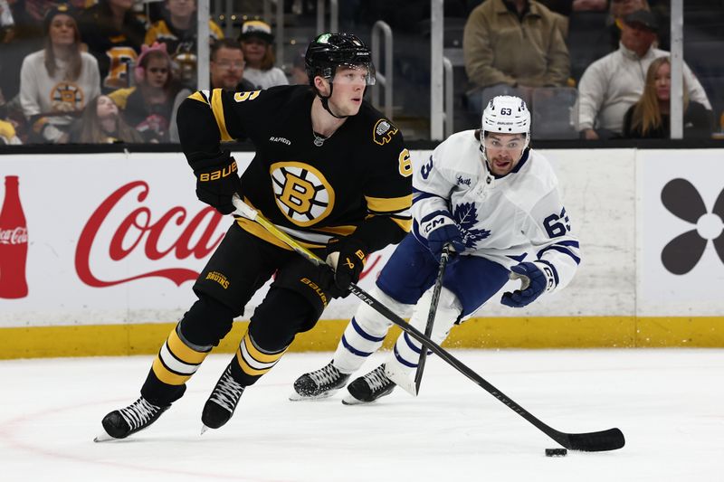 Mar 24, 2026; Boston, Massachusetts, USA; Toronto Maple Leafs left wing Matias MacCelli (63) gives chase to Boston Bruins defenseman Mason Lohrei (6) during the first period at TD Garden. Mandatory Credit: Winslow Townson-Imagn Images