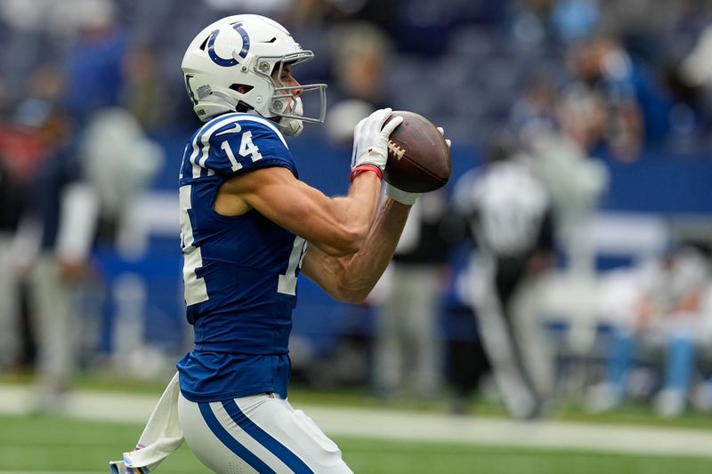 Indianapolis Colts wide receiver Alec Pierce (14) warms up before an NFL football game against the Tennessee Titans, Sunday, Oct. 8, 2023, in Indianapolis. (AP Photo/Darron Cummings)