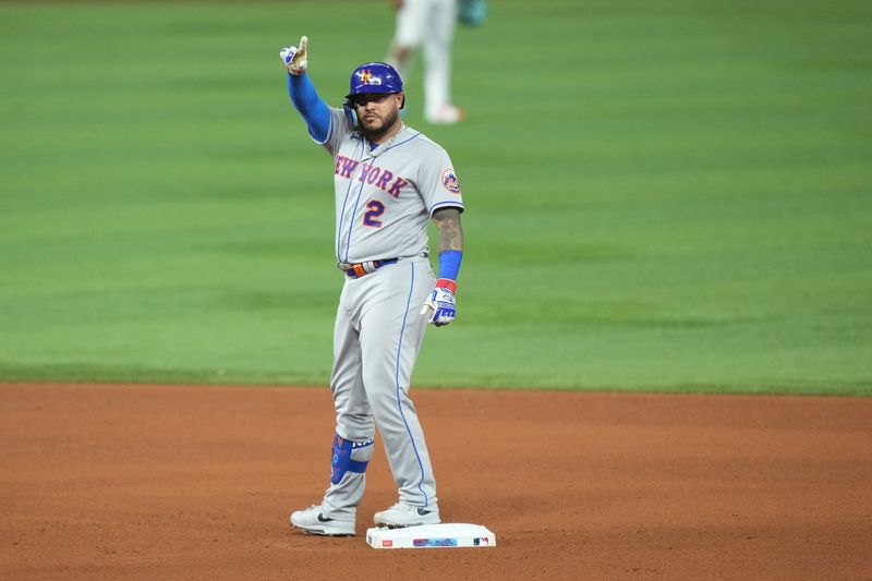 Sep 20, 2023; Miami, Florida, USA;  New York Mets catcher Omar Narvaez (2) celebrates a double in the fourth inning against the Miami Marlins at loanDepot Park. Mandatory Credit: Jim Rassol-USA TODAY Sports