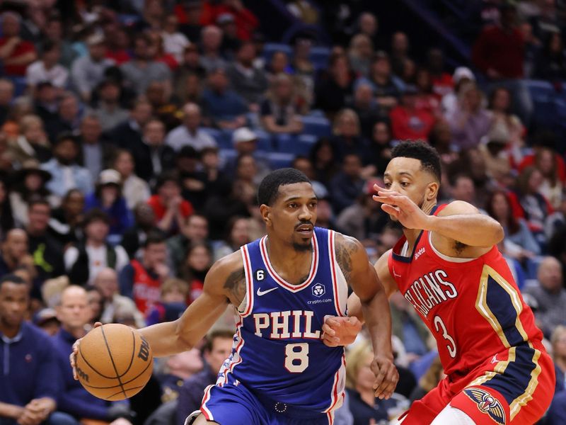 NEW ORLEANS, LOUISIANA - DECEMBER 30: De'Anthony Melton #8 of the Philadelphia 76ers drives against CJ McCollum #3 of the New Orleans Pelicans during the second half at the Smoothie King Center on December 30, 2022 in New Orleans, Louisiana. NOTE TO USER: User expressly acknowledges and agrees that, by downloading and or using this Photograph, user is consenting to the terms and conditions of the Getty Images License Agreement. (Photo by Jonathan Bachman/Getty Images)