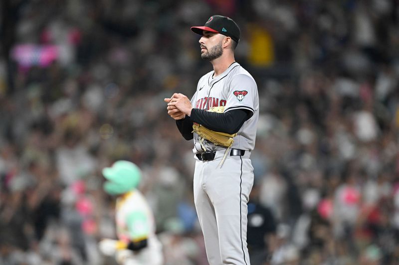 July 5, 2024; San Diego, California, USA; Arizona Diamondbacks relief pitcher Joe Jacques (55) stands on the mound after giving up a home run to San Diego Padres catcher Kyle Higashioka (20) during the sixth inning at Petco Park. Mandatory Credit: Denis Poroy-USA TODAY Sports